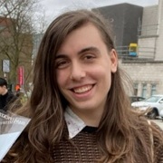 Smiling person with long brown hair